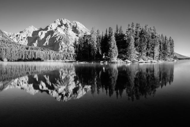 Boulder Island and Mount Moran, reflected on the surface of Leigh Lake.