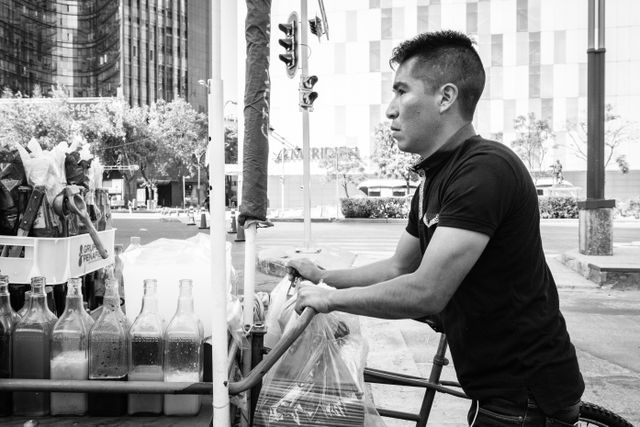 A man pushing a snacks cart on the Paseo de la Reforma in Mexico City.