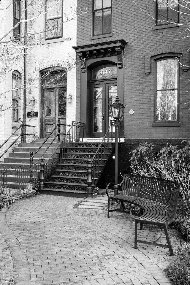 A curving pathway leading to a Capitol Hill rowhouse's doorstep.