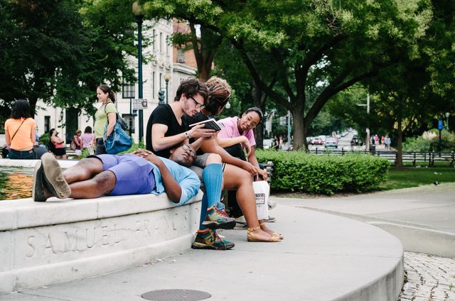 A group of young people hanging out in Dupont Circle, Washington, DC.