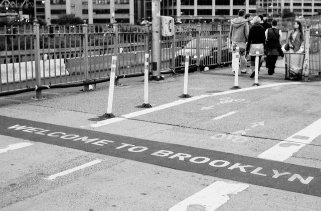 The "welcome to Brooklyn" sign at the end of the Brooklyn Bridge.