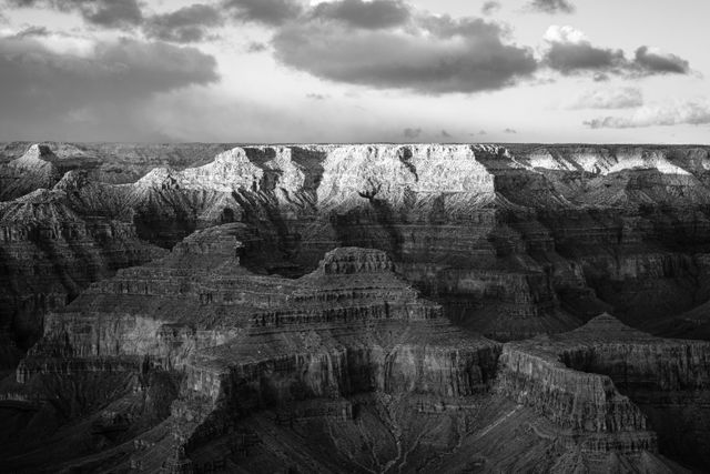 The North Rim of the Grand Canyon, in late afternoon, seen from Pima Point. Only the very top of the rim is lit by the sun.