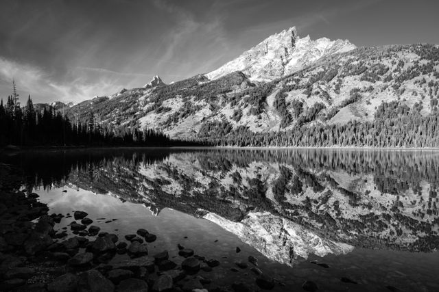 Teewinot Mountain reflected off the waters of Jenny Lake in Grand Teton National Park.