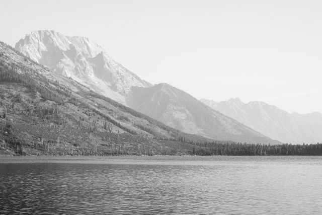 Mount Moran seen from the shore of Jenny Lake on a hazy, smoky day.