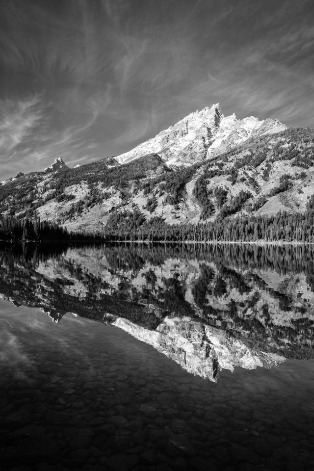 Teewinot Mountain reflected off the waters of Jenny Lake at Grand Teton National Park.