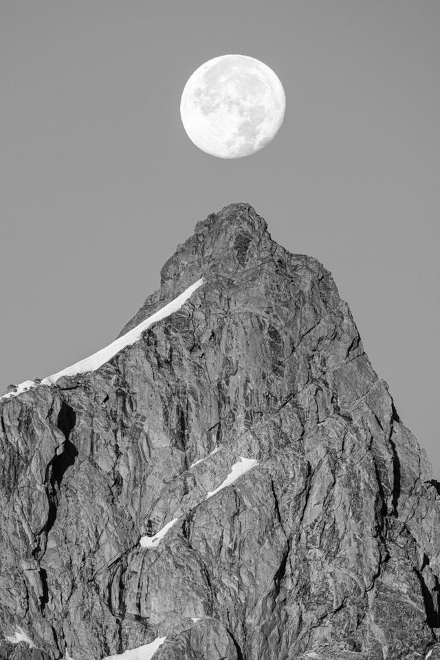 The Moon, hanging directly over the summit of Grand Teton.