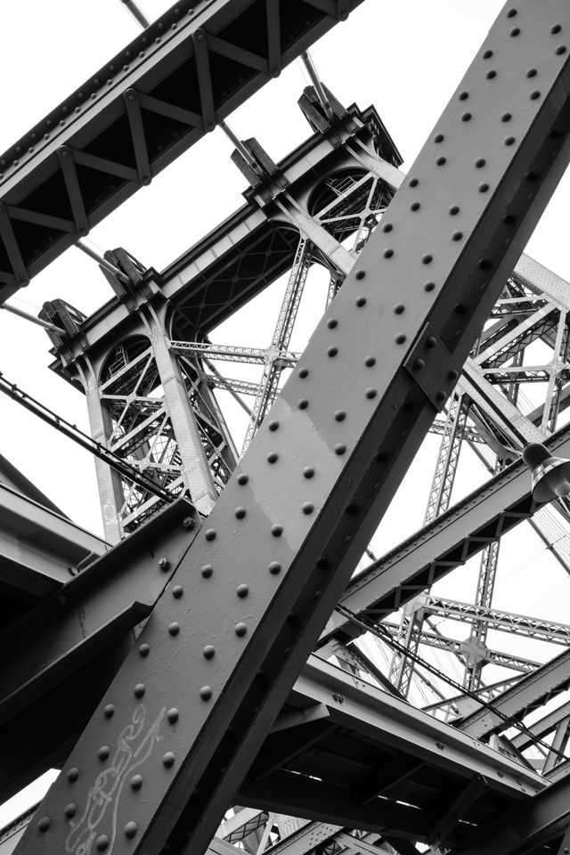 Looking up at the trusswork of one of the towers of the Williamsburg Bridge in New York City.