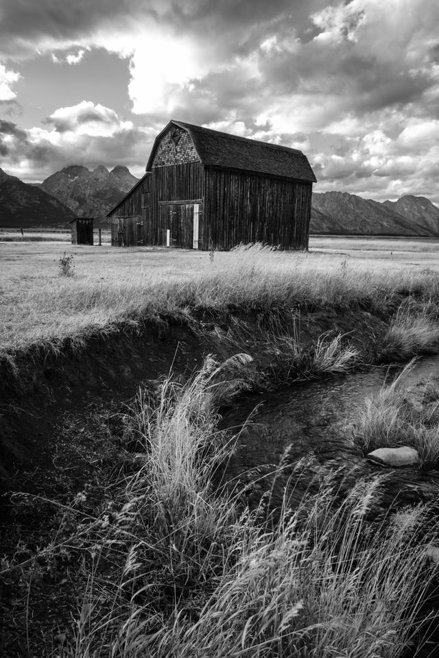 The Reed Moulton barn at Mormon Row, next to a creek.