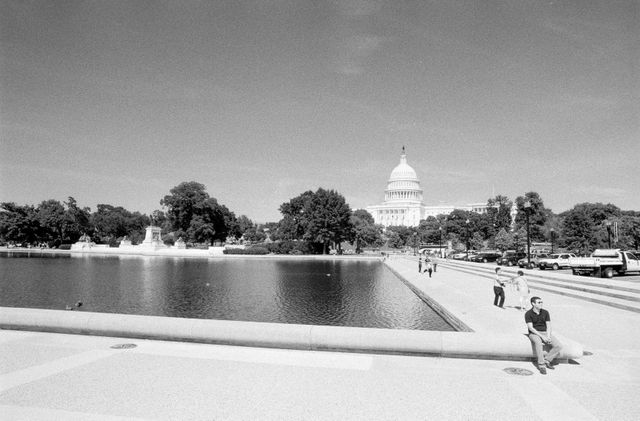 Tourists in front of the Capitol Reflecting Pool.