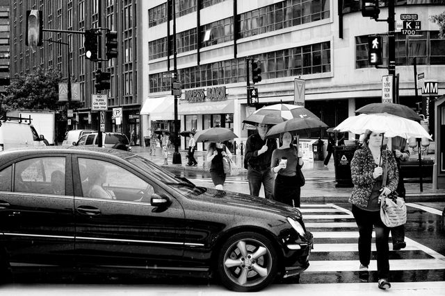 Pedestrians crossing the street near Farragut Square.