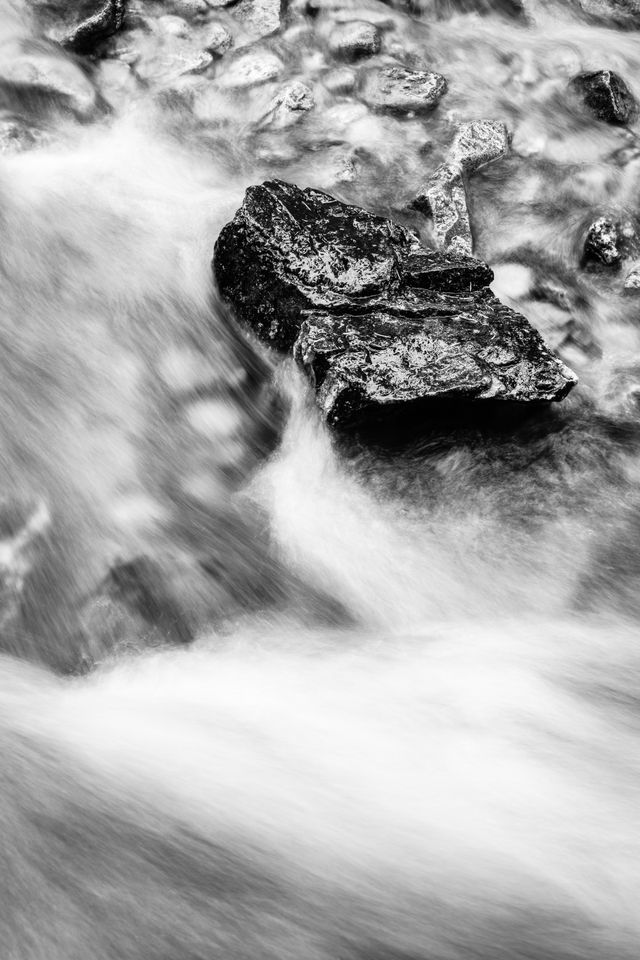 Water flowing over a rock at Cascade Creek.