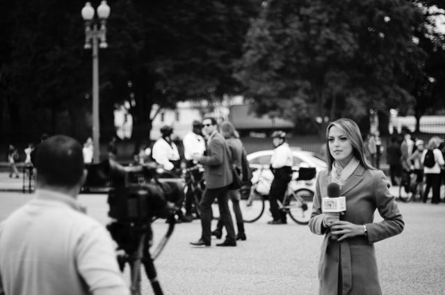 A reporter from NTN in front of the White House.