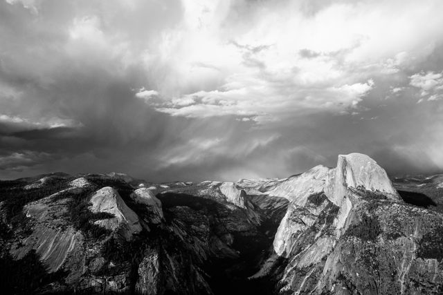 Half Dome, seen under stormy skies at sunset from Glacier Point.