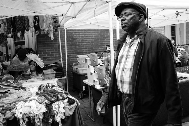 A man walking on Eastern Market.