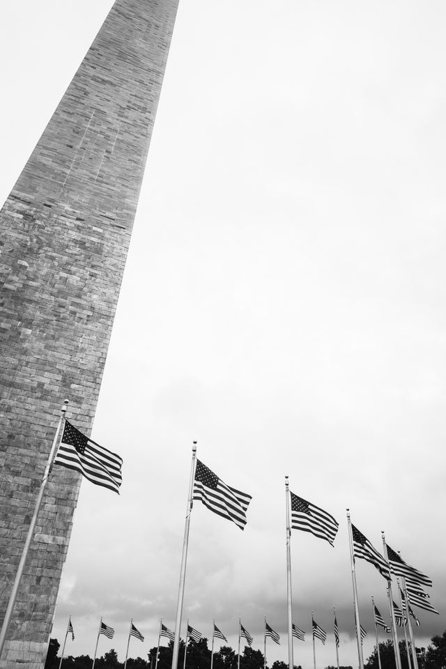 The Washington Monument, surrounded by flags.