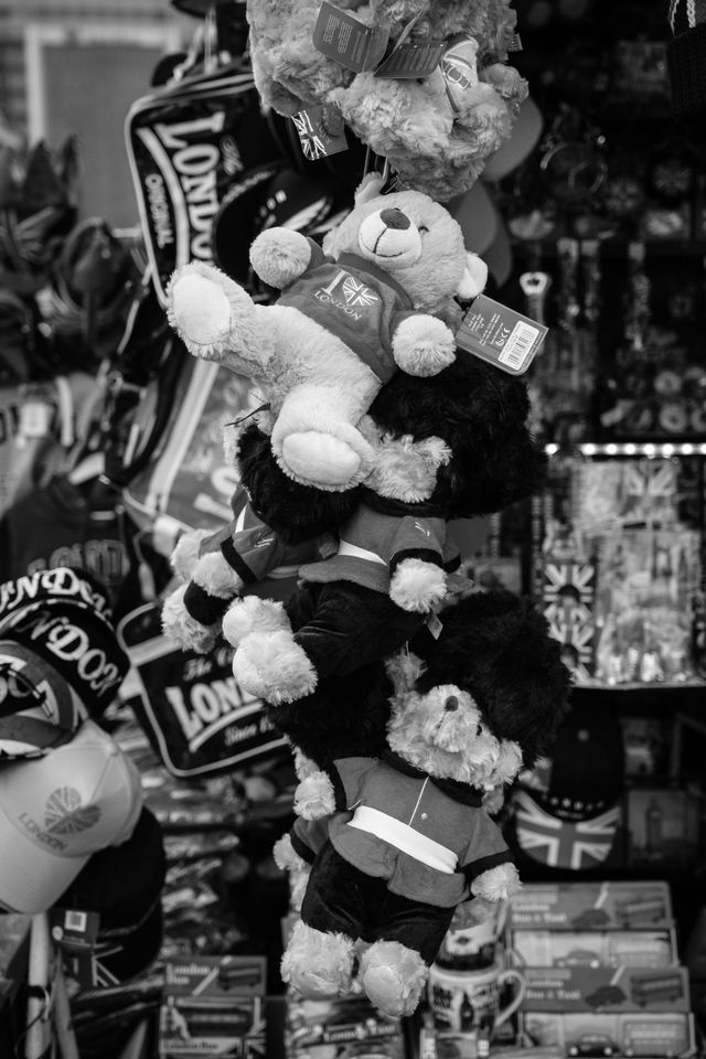 Teddy bears hanging at a souvenir stand on Westminster Bridge.