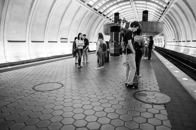 People on the platform waiting for a train at Tenleytown station in Washington, DC.