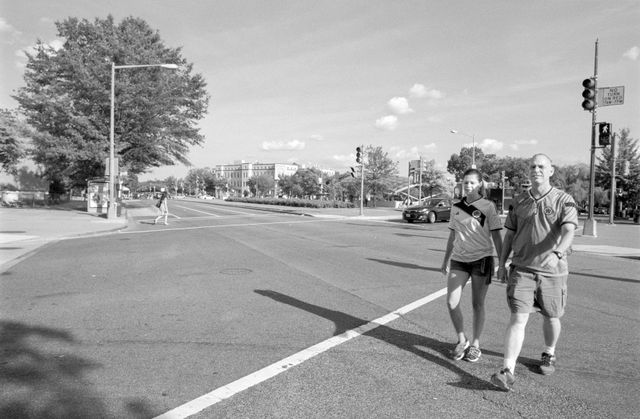 People crossing Pennsylvania Avenue near Eastern Market.