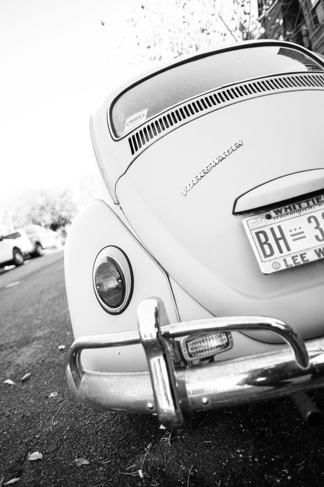 The rear end of a Volkswagen Beetle parked on Independence Avenue in Capitol Hill.