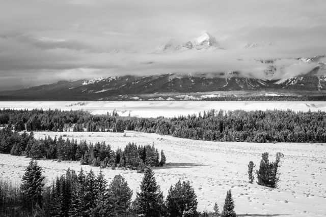 Buck Mountain, partially hidden by clouds during winter, from Teton Point turnout.