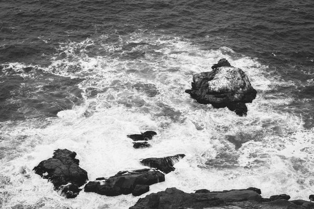 Waves breaking on the rocks at the bottom of the cliffs near the Point Reyes Lighthouse.