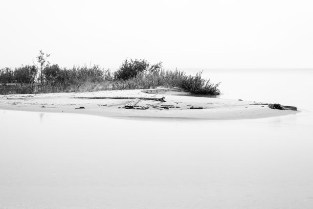 A long exposure photo of a sandy key at the mouth of the Platte River.