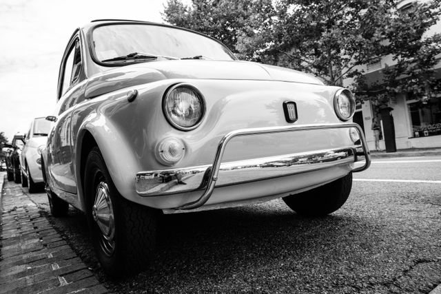 A vintage Fiat 500 parked in Georgetown.