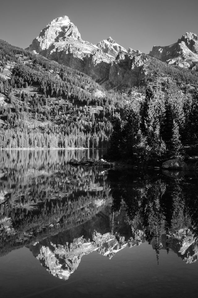 Grand Teton reflected off the waters of Taggart Lake.