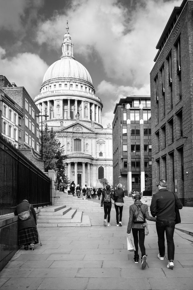 People walking towards St. Paul's Cathedral.