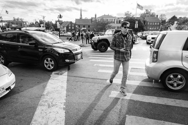 A man crossing the street in downtown Annapolis, Maryland.