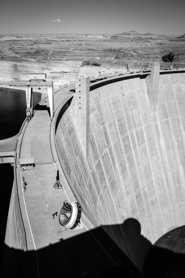 The Glen Canyon Dam, seen from the Carl Hayden Visitor Center. The bathtub ring can be seen above the water behind the dam.