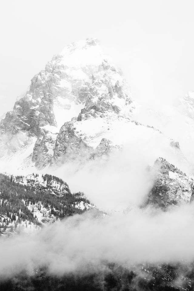 Grand Teton, partially covered in clouds and fog after a storm.