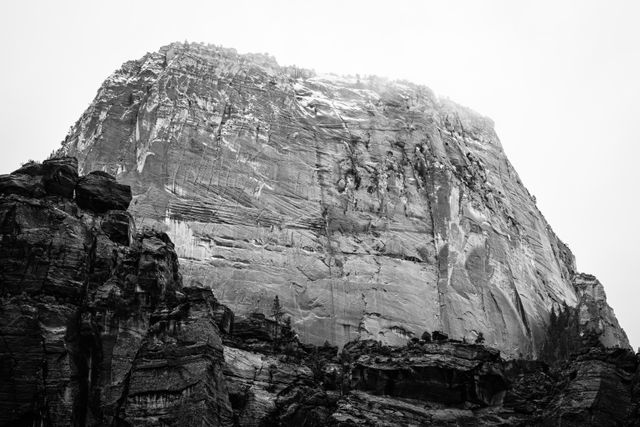 The Great White Throne, partially shrouded in fog and with its summit covered in snow.