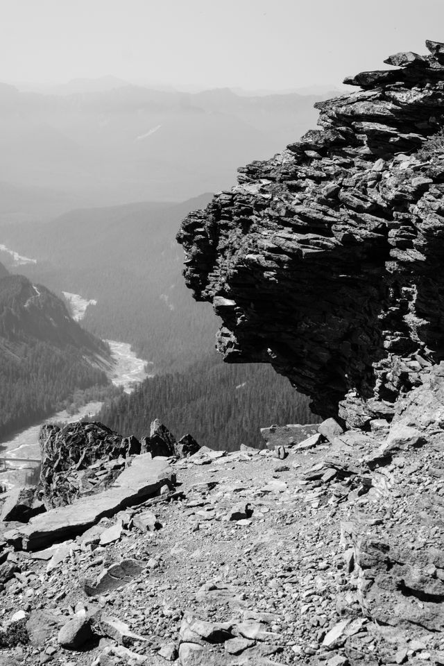 Jagged, volcanic rocks at the very top of the Skyline Trail in Mount Rainier National Park, with the Nisqually River in the distance.