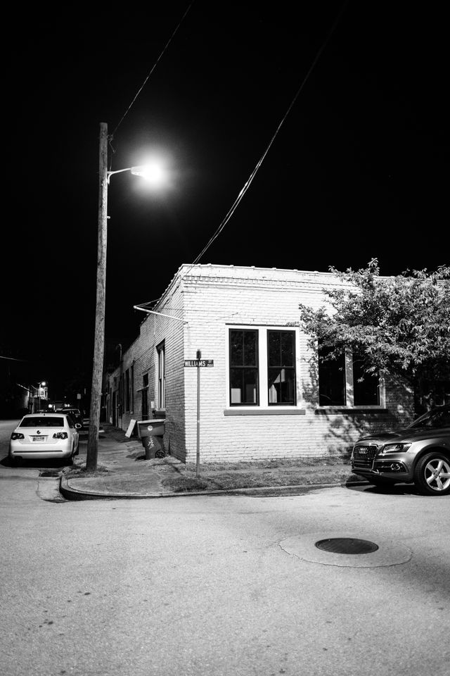 A house on the corner of Williams Street and 17th Street in Southside Chattanooga, at night.