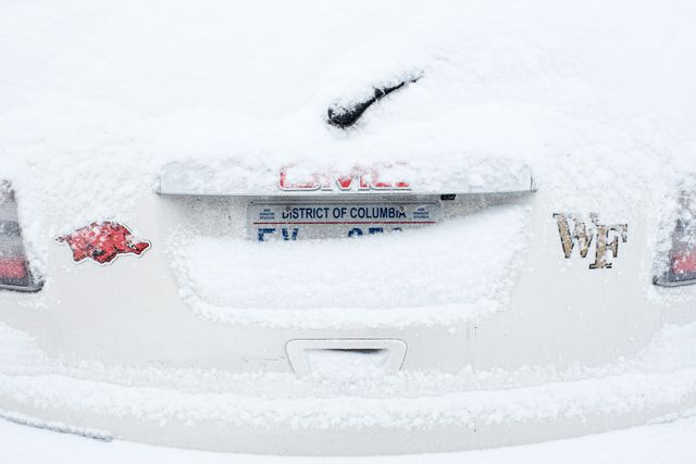 A snow-covered car.