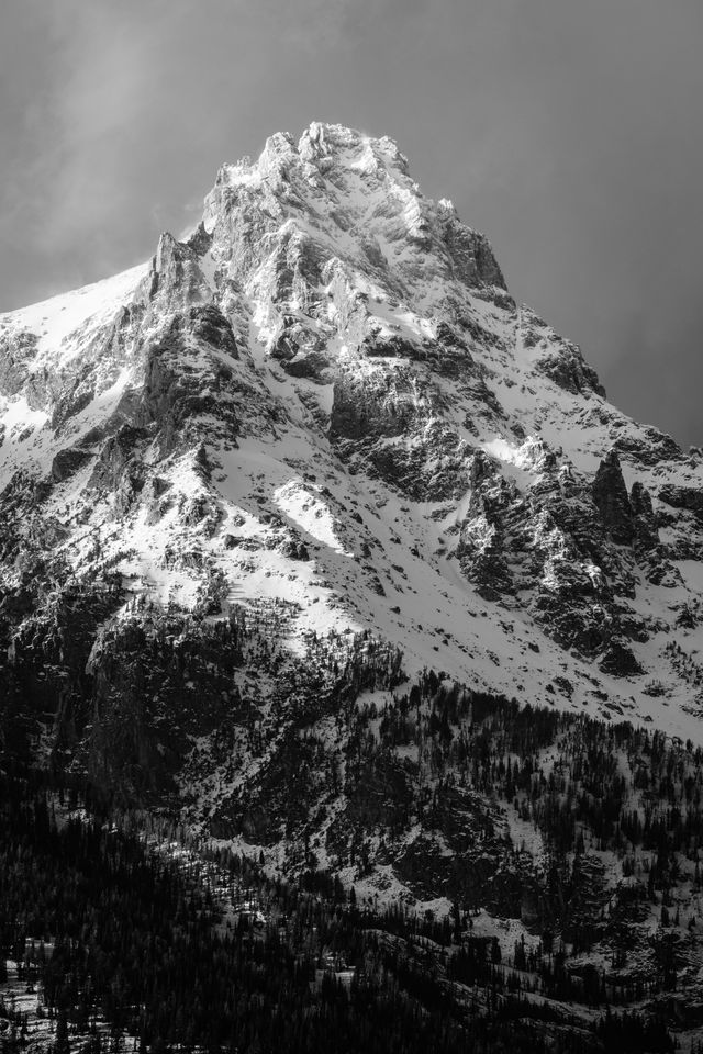 Teewinot Mountain, lit by the afternoon sun, after a late fall snowstorm.