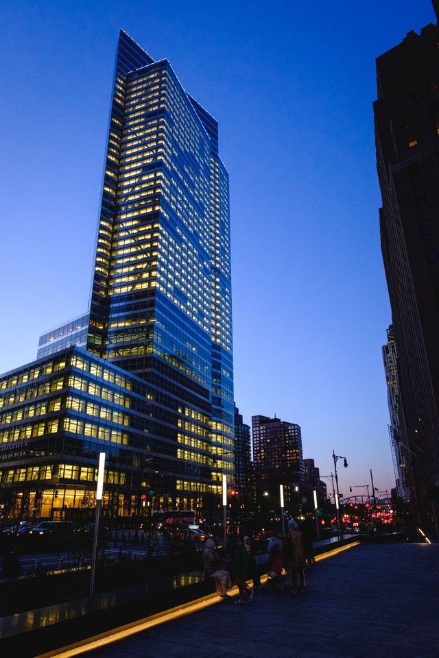 A building in the Financial District of New York, at dusk.