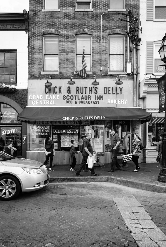 People walking on the street in front of Chick & Ruth's Delly in downtown Annapolis.