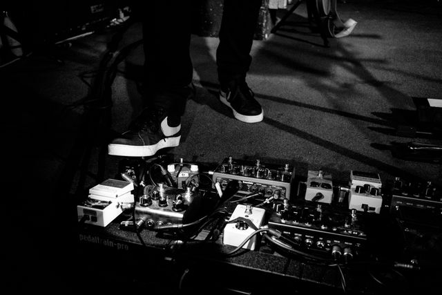 Billy Kennedy's feet on a pedalboard at a Frightened Rabbit concert at Black Cat.