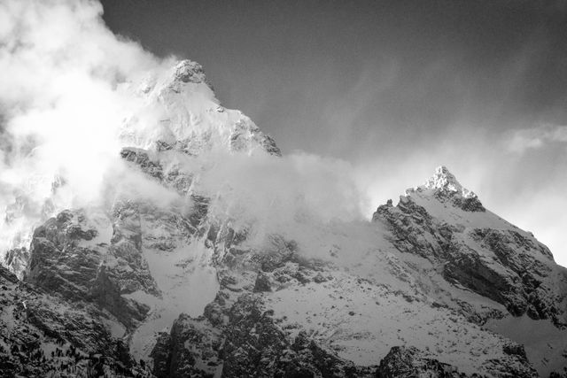 Grand Teton emerging from the clouds at sunset.