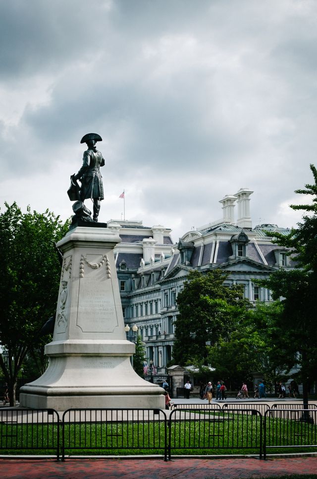 Statue of General Rochambeau at Lafayette Park in Washington, DC, with the Old Executive Office Building in the background.