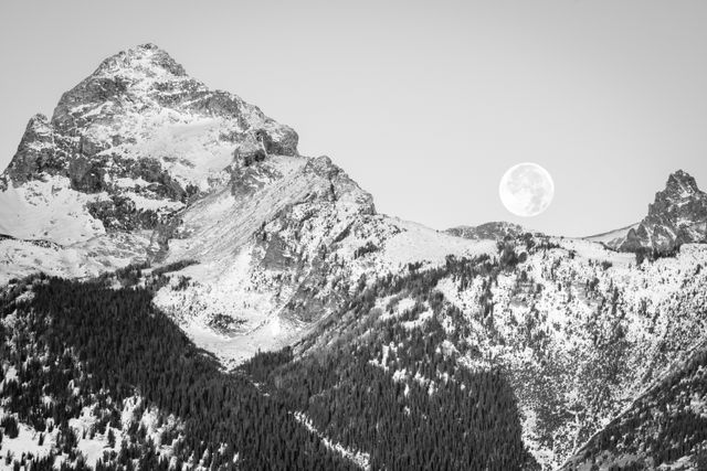 The Moon setting behind the Tetons.