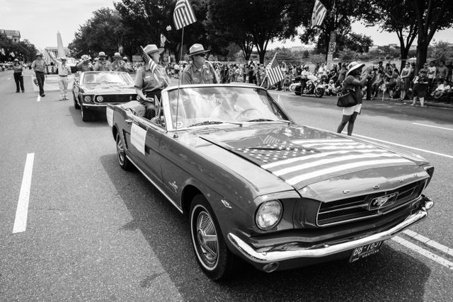 Gay Vietzke and Mike Reynolds, Superintendent of the National Mall & Memorial Parks and Director of the National Park Service, riding on the back of a Mustang at the Independence Day parade in Washington, DC.