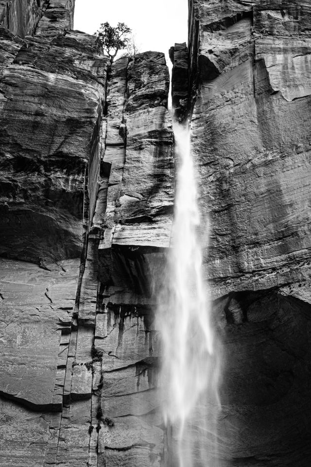 A waterfall flowing high above Upper Emerald Pool.