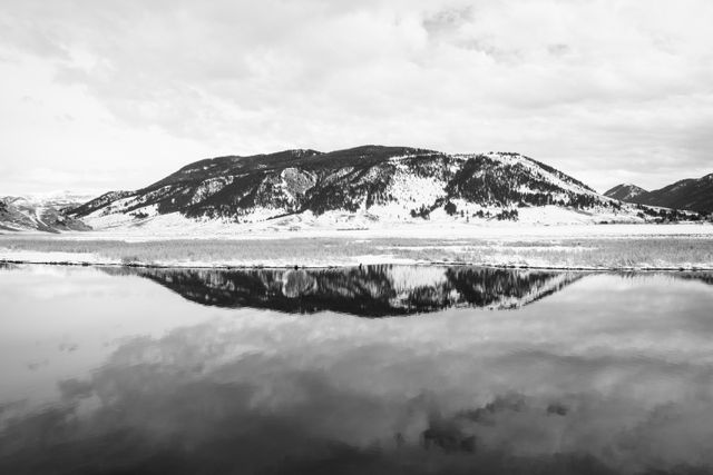 Mountains reflected off the waters of Flat Creek at the National Elk Refuge in Wyoming.