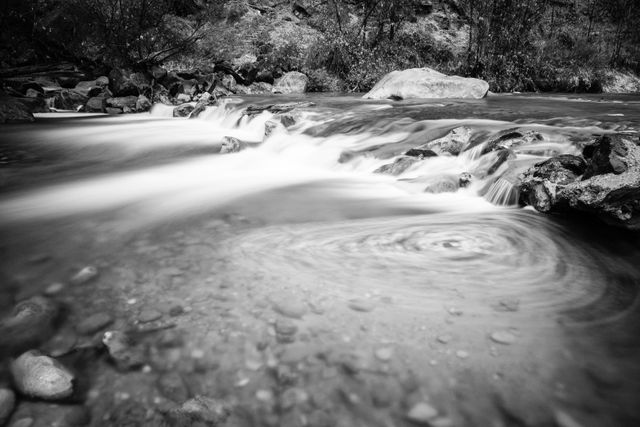 The Virgin River running over rocks at the Temple of Sinawava, with an eddy seen in the foreground.