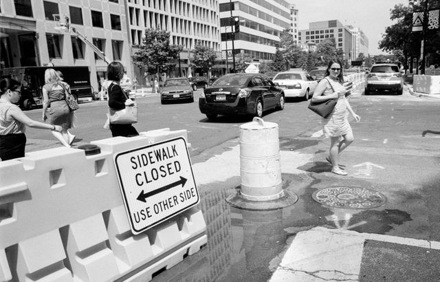 Pedestrians crossing the street on Connecticut Avenue.