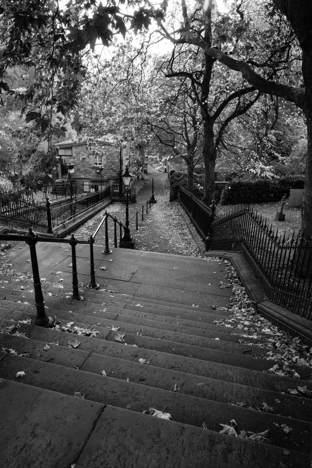 Steps descending into a footpath at the western end of Princes Street Gardens in Edinburgh.